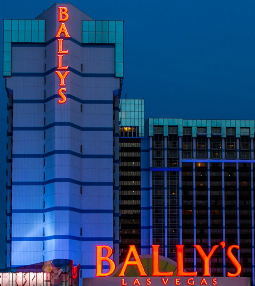 Bally's Las Vegas Hotel & Casino exterior at night with red neon signs